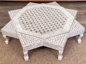 A Stylish Coffee Table Clad In Mother Of Pearl Inlay With Octagonal Glass Top