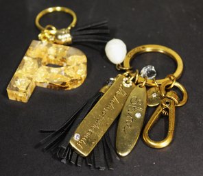 Lot Two Key Chains, Lucite Plastic 'P' With Gold Leaf And Chico's Gold Tone Motto Keychain1