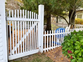 A Wood Picket Fence And Gate