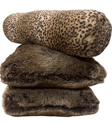 A Pair Of Magaschoni Plush Pillows With A Racel Zoe Leopard Lumbar Pillow