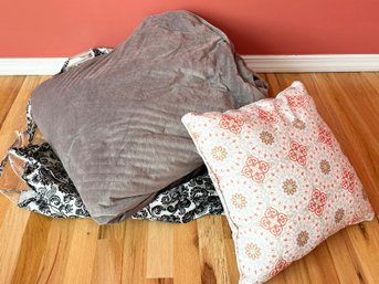 A Throw Blanket And Accent Pillow