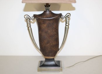 A Trophy Style Lamp With Suede Shade