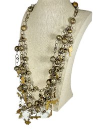 South American Silver Beaded Necklace Having Gold Plated Figural Charms