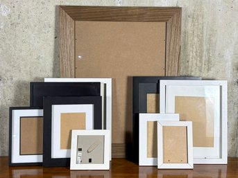 A Large Collection Of Photo Frames - Large And Small