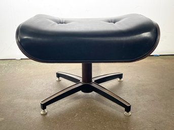 A Vintage Eames Style Ottoman In Black Leather