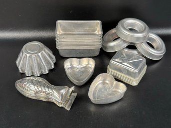 An Assortment Of Miniature Molds & Baking Pans