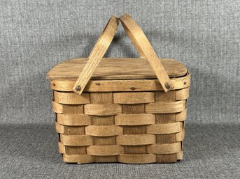 A Vintage Woven Picnic Basket With Removable Pie Shelf