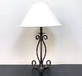 A Wrought Iron Lamp