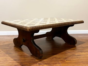 A Vintage Coffee Table With Tile Top