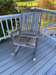 A Weathered Teak Wood Rocking Chair By Gloster