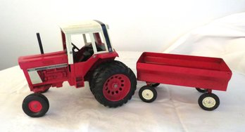 ERTL International Harvester 1586 Pressed Steel Farm Tractor With Grain Pull