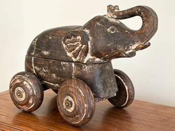 An Elephant On Wheels Carving