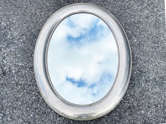 A Burnished Silver Toned Decorative Oval Mirror By Pottery Barn