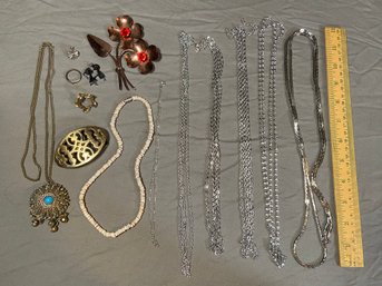 Assorted Costume Jewelry: Brass, Sterling Silver Flower Brooch Pin, Kissing Couple Charm, Silver Necklace