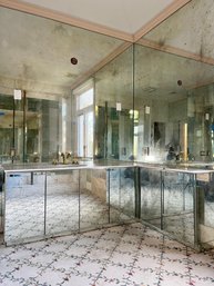 An Elegant Antiqued Mirrored L-shaped Vanity With Marble Top - Her Bath