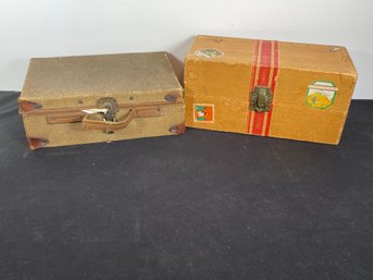 TWO MINIATURE DOLL TRUNKS WITH CLOTHES
