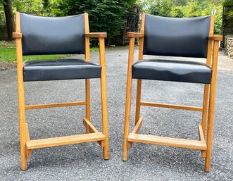 A Pair Of Vintage Oak Counter Height Stools In Black Leather