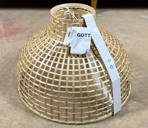 A Large Light Shade In Modern Rattan