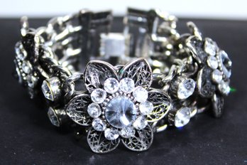 Contemporary Silver Tone Bracelet Having Large White Rhinestone Flowers