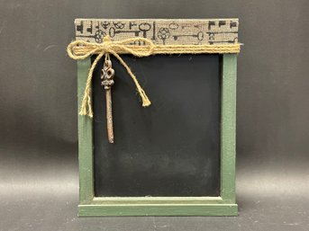 A Rustic Wood-Framed Chalkboard In Green With A Vintage Key Theme