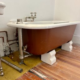 An Antique Cast Iron Stand Alone Tub With Fireclay Feet - Basement