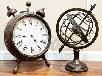 An Alarm Clock And Armillary Sphere