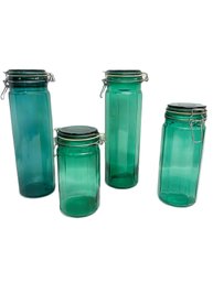 Four Green Blown Glass Canisters