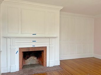 An Antique Mantel And Wood Paneled Wall - Room O23