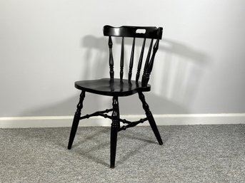 A Wooden Side Chair With A Black Finish & Turned Spindles