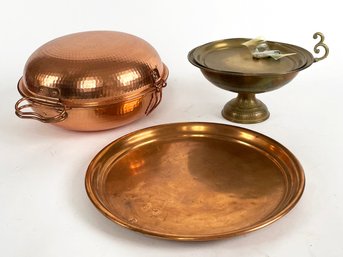 A Collection Of Copper And Brass Cooking And Serving Ware