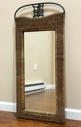 A Wicker And Wrought Iron Mirror