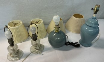 A Group Of Four Glass And Ceramic Table Lamp.