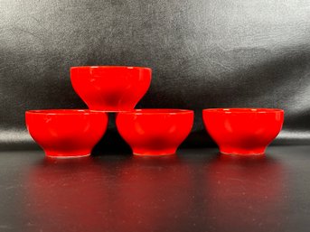 A Set Of Four Coupe Bowls In Red Ceramic By Crate & Barrel