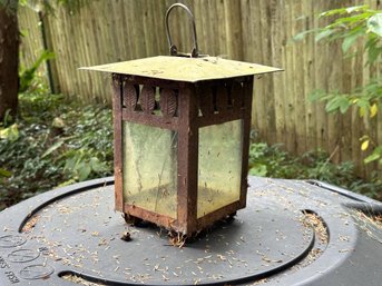 A Hanging Lantern In Metal With Leaf Detailing & Glass Panels