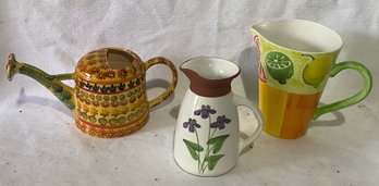 Two Ceramic Pitchers And Watering Can