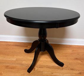 Round Pedestal Table With A Black Semi Gloss Finish