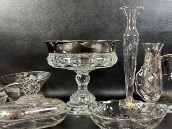 A Grouping Of Vintage Glassware With Silver Overlay