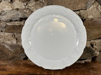 A Large Round Platter In Milk Glass