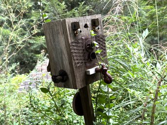 Assemblage Garden Art: An Anthropomorphic Bird House With Robot-Like Features