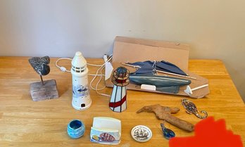 Lot Of Nautical Items Including Lighthouse Lamp, Sand Dollars, Shore Bird, And More