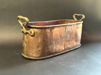 A Classic Copper Tub With Brass Handles