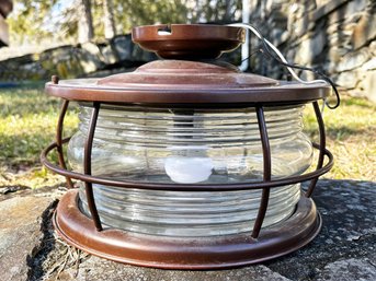 A Bronze Tone Flush Mount Ceiling Fixture In Lantern Form