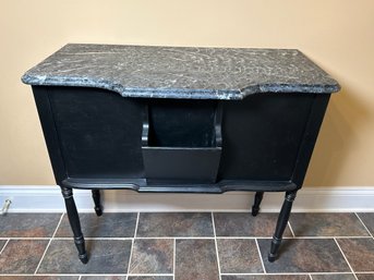 A Black Painted Side Table With Built In Front Pocket & 'Marble-like' Wooden Top