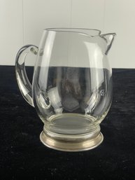 Silver Colored Pedestal Base Clear Glass Pitcher