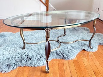 A Glass And Brass Coffee Table