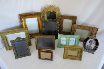 A Dozen Photo Frames Of Various Styles