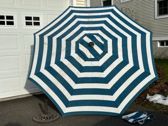 A Striped Canvas Patio Umbrella With Metal Base, 9'