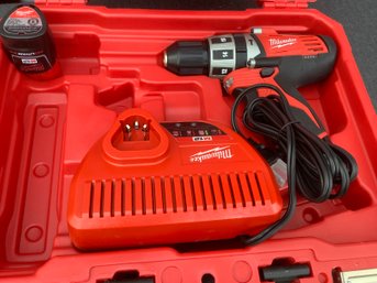 Milwaukee 3/8' Hammer Drill With Charger #295