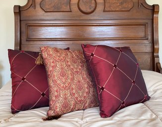 Trio Of Red And Patterned Pillows