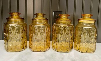 Lot Of Four Amber Glass Canisters